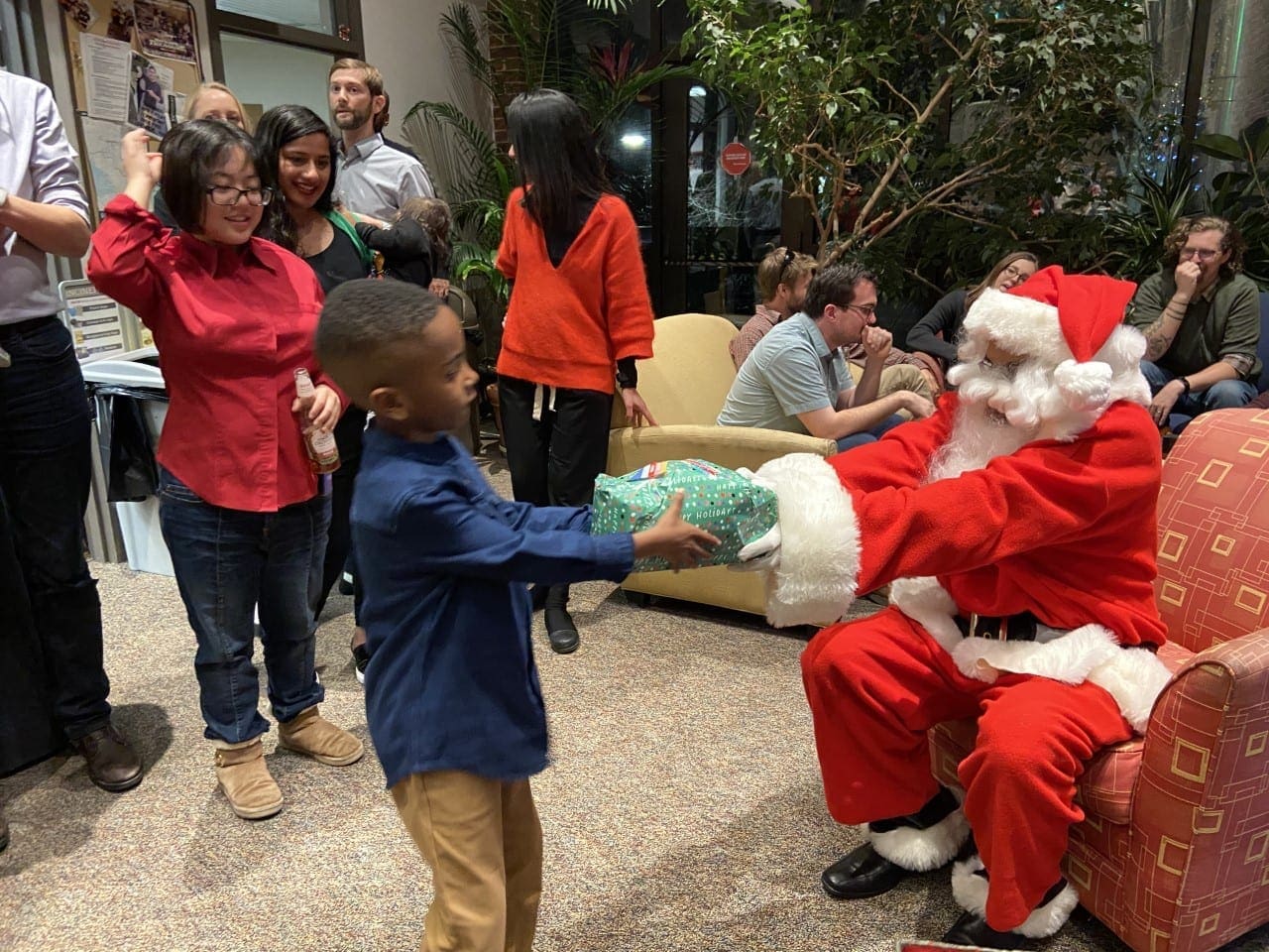 Santa hands out presents at the EPS holiday party