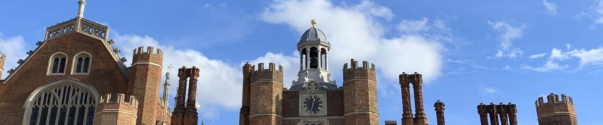 Hampton Court Palace, London, UK, 16th c., interior façade with a view of one of its clock towers; Nov 2018