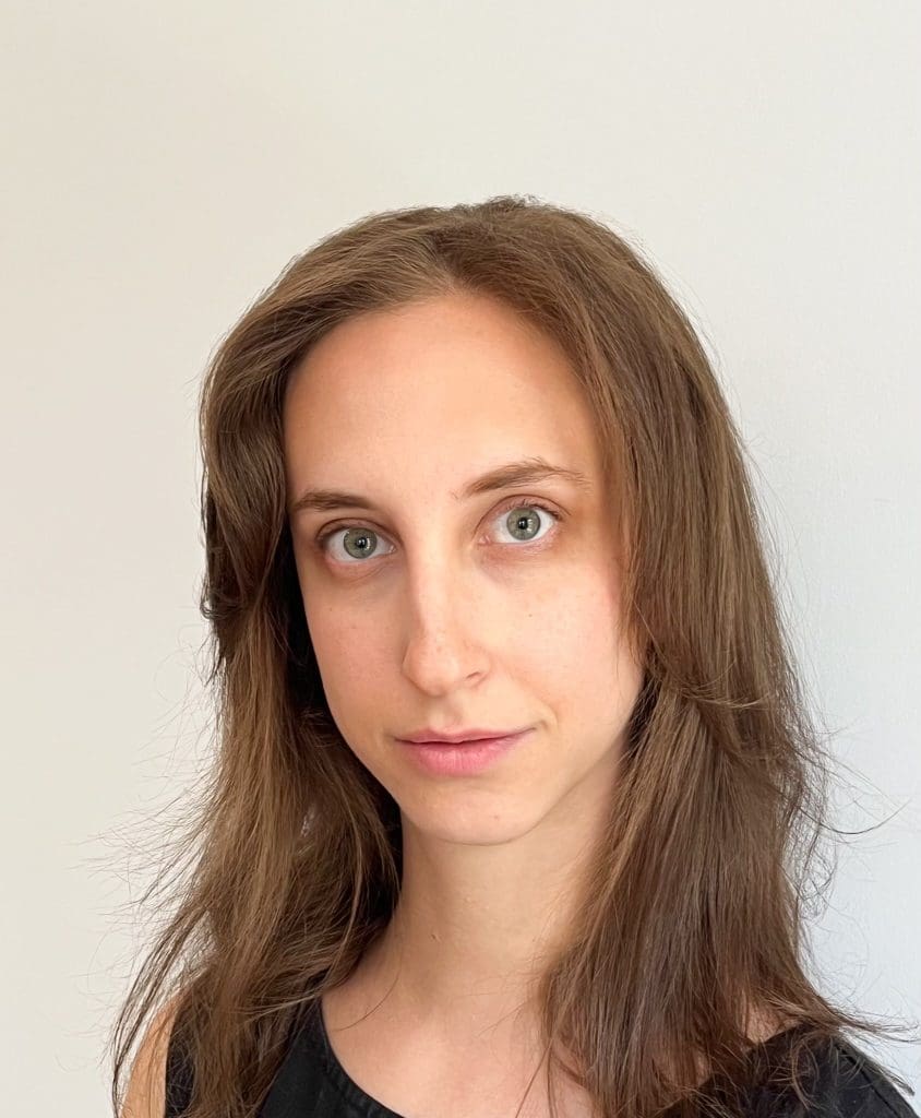 A headshot of a woman looking directly at the camera.