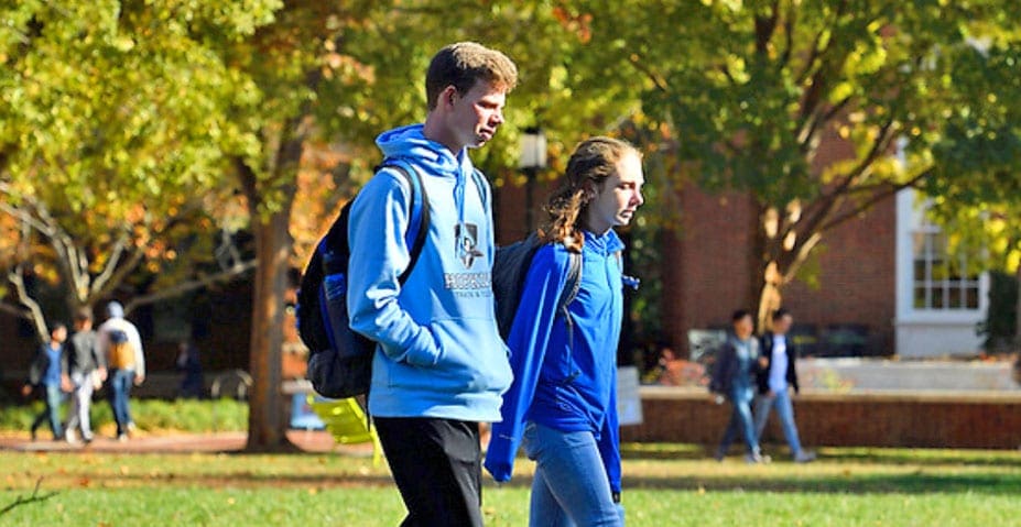 two students walking on campus