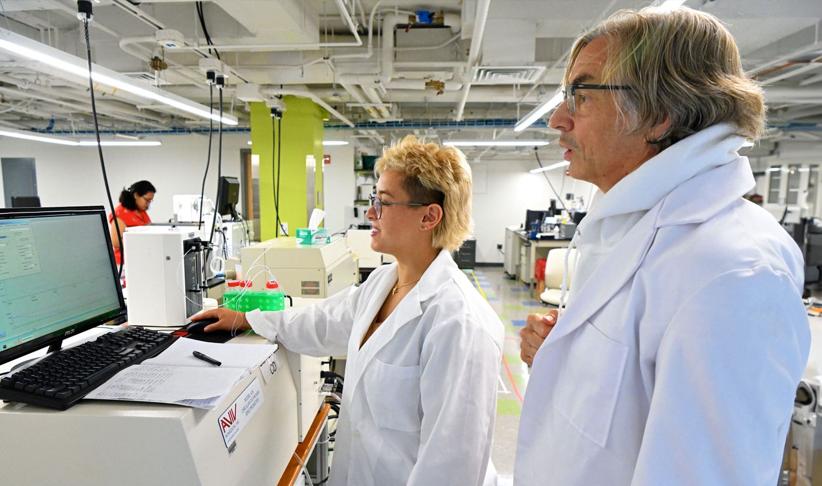 Biophysics profess Douglas Barrick and graduate student in his lab.