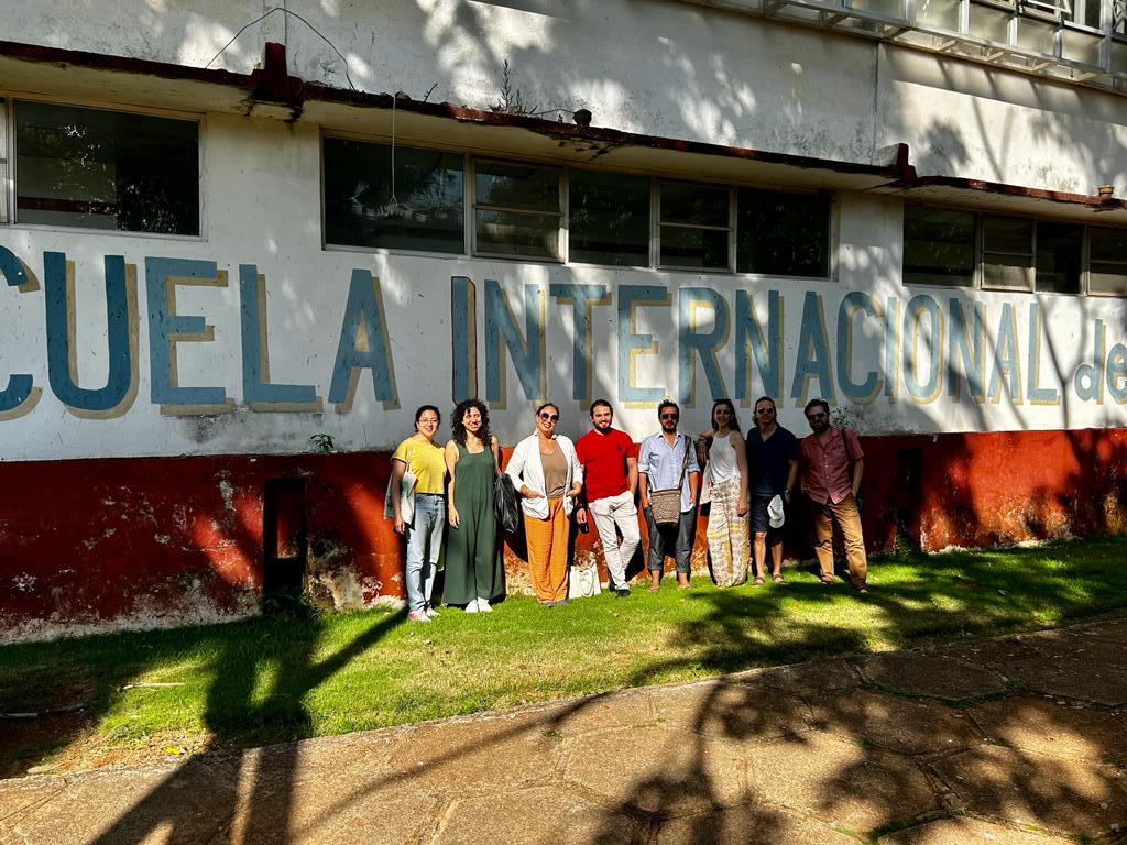 CAMS participants pictured here standing in front of the Escuela Internacional de Cine y Televisión