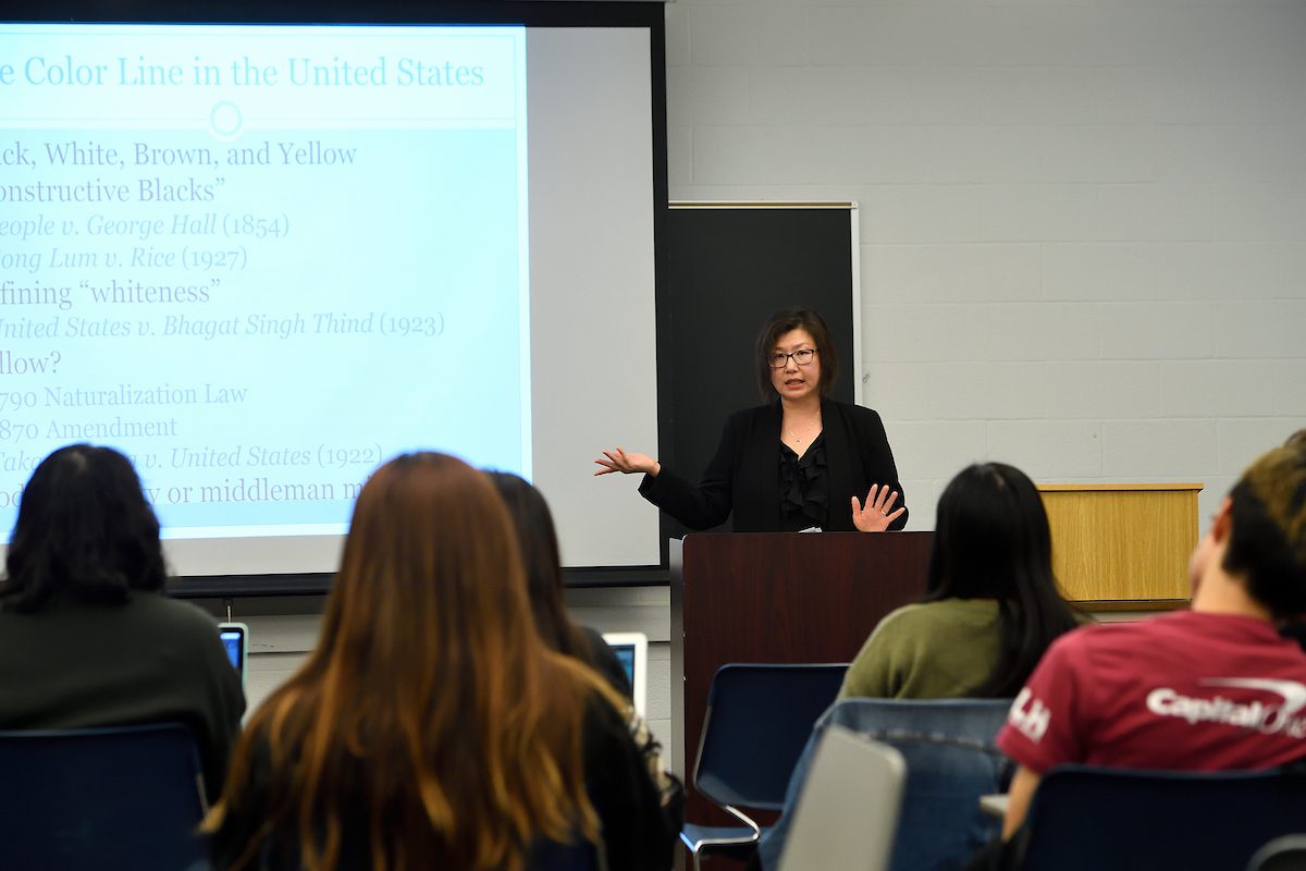 Erin Auran Chung in front of a classroom