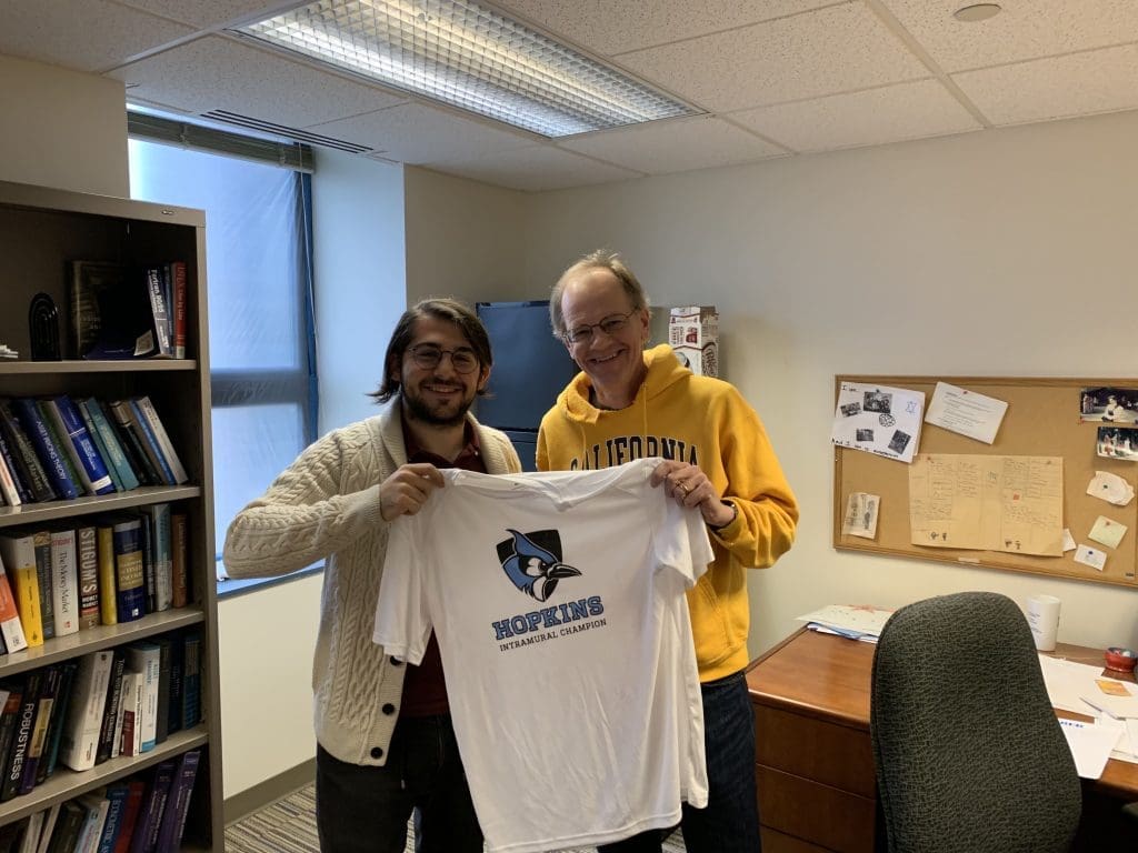 Derin Aksit presenting a Championship T-shirt to Prof. Duffee