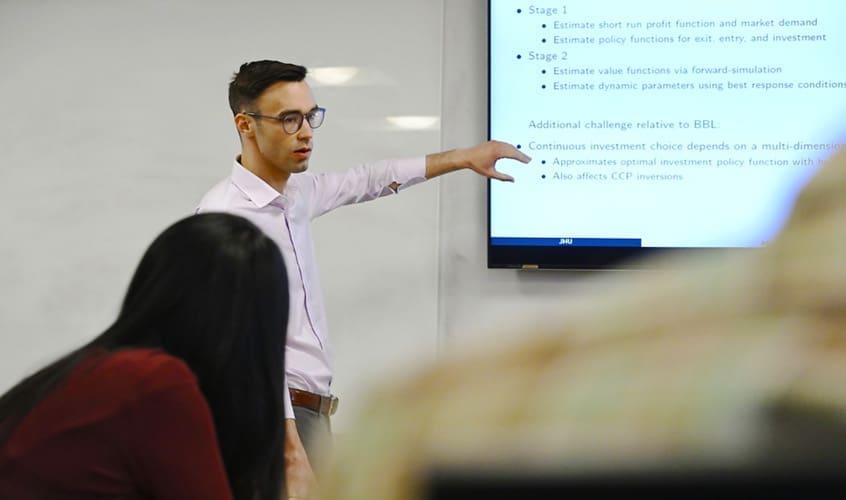 Professor Jonathan Elliott teaching graduate class.