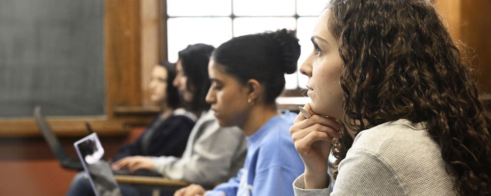 side view of students listening to class lecture