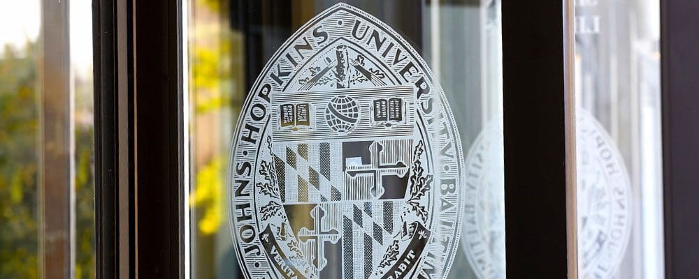 open glass doors with Johns Hopkins Seal imprinted