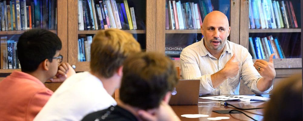 Assistant professor Jesse Rosenthal leads a discussion with students.