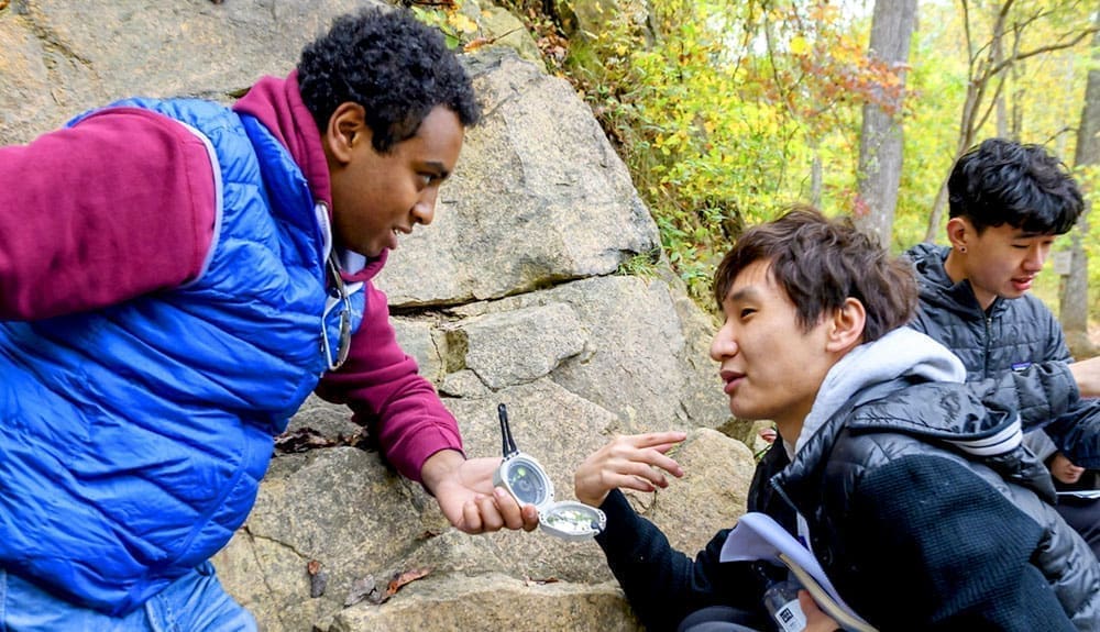 A graduate student in discussion with an undergrad in Gambrills State Park.