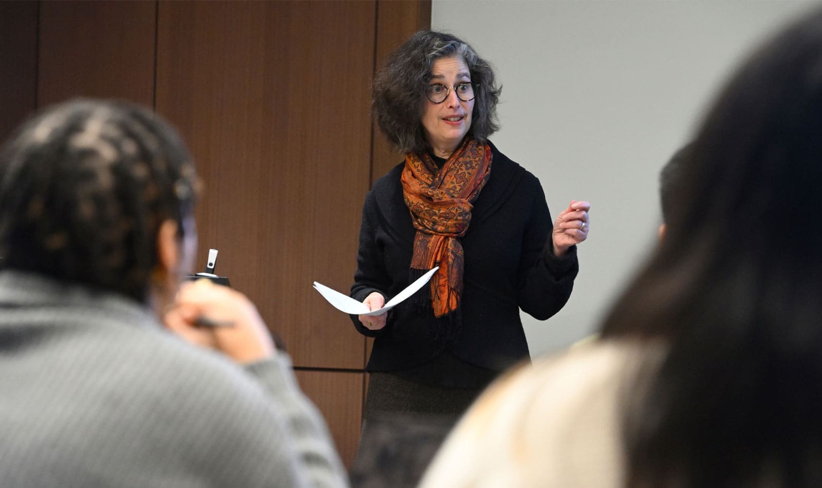 Faculty (Tobie Meyer-Fong) in the center teaching a class of undergraduate students who are in the foreground at the Bloomberg Hopkins Center, Washington, D.C.