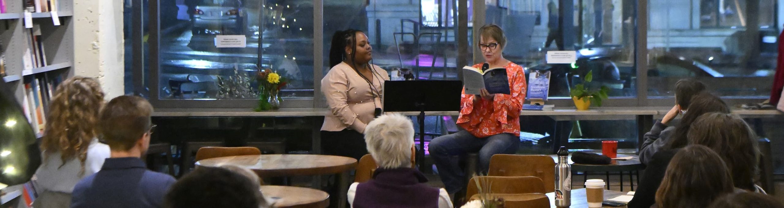 Humanities in the Village event with Dr. Elizabeth Bronwyn Boyd (r) reading her book, Southern Beauty: Race, Ritual, and Memory in the Modern South. Samanda Robinson (l), PhD candidate, English, moderated the event.