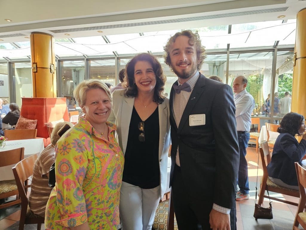 Dr. Giovanna Dore celebrates with DJ Quezada, winner of the Pier Larson Prize, and his mom.