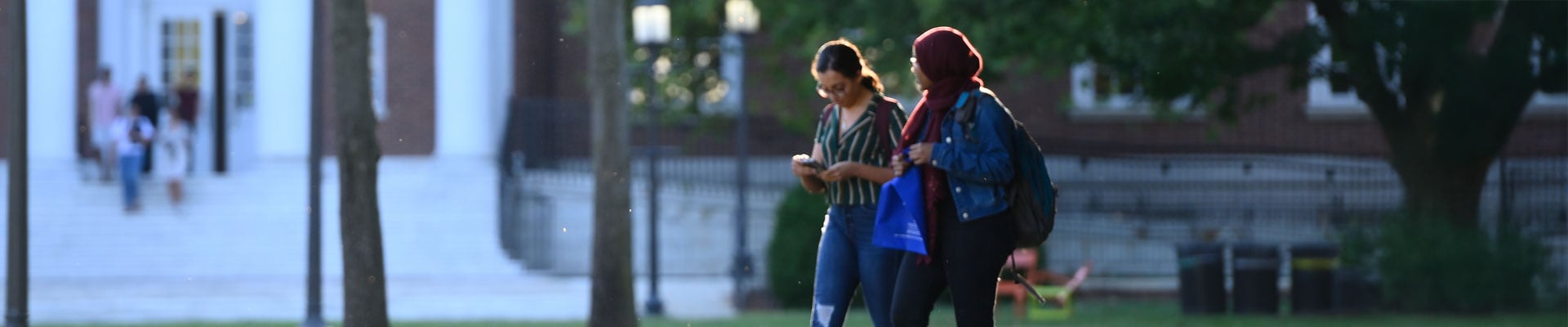 Random image of students on campus or a campus building on a sunny day.