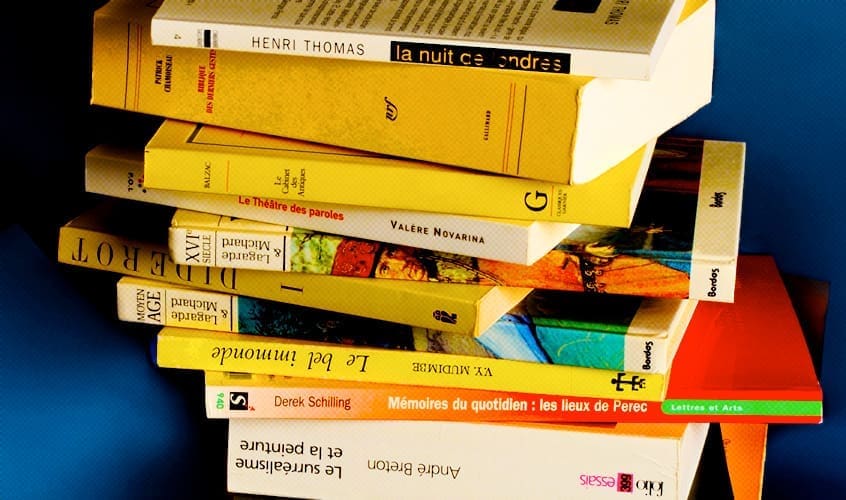 stack of books with French titles