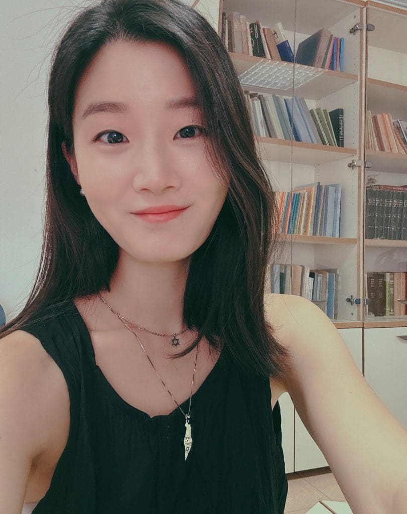 Picture of woman in front of bookcase