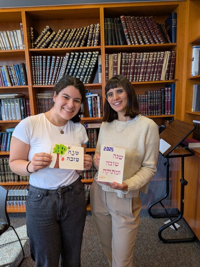 students presenting Rosh Hashana Cards they made.