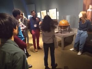 Students at the American Philosophical Society touring the 2019 exhibition Mapping a Nation: Shaping the Early American Republic