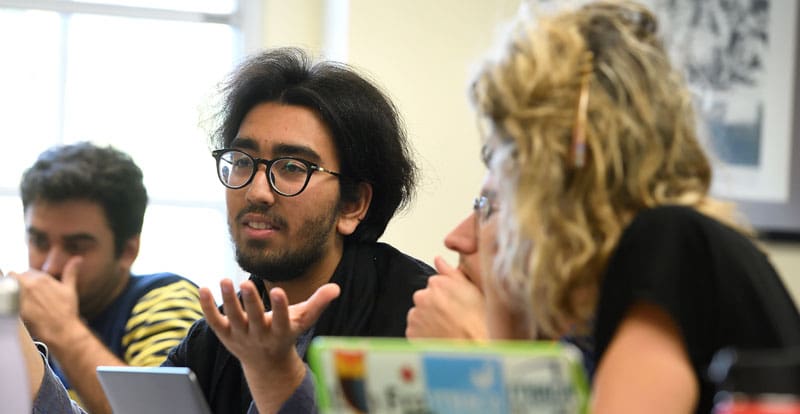 Graduate students in discussion as part of the course "Postcolonial Political Economy" taught by professor Robbie Shilliam in 2018.