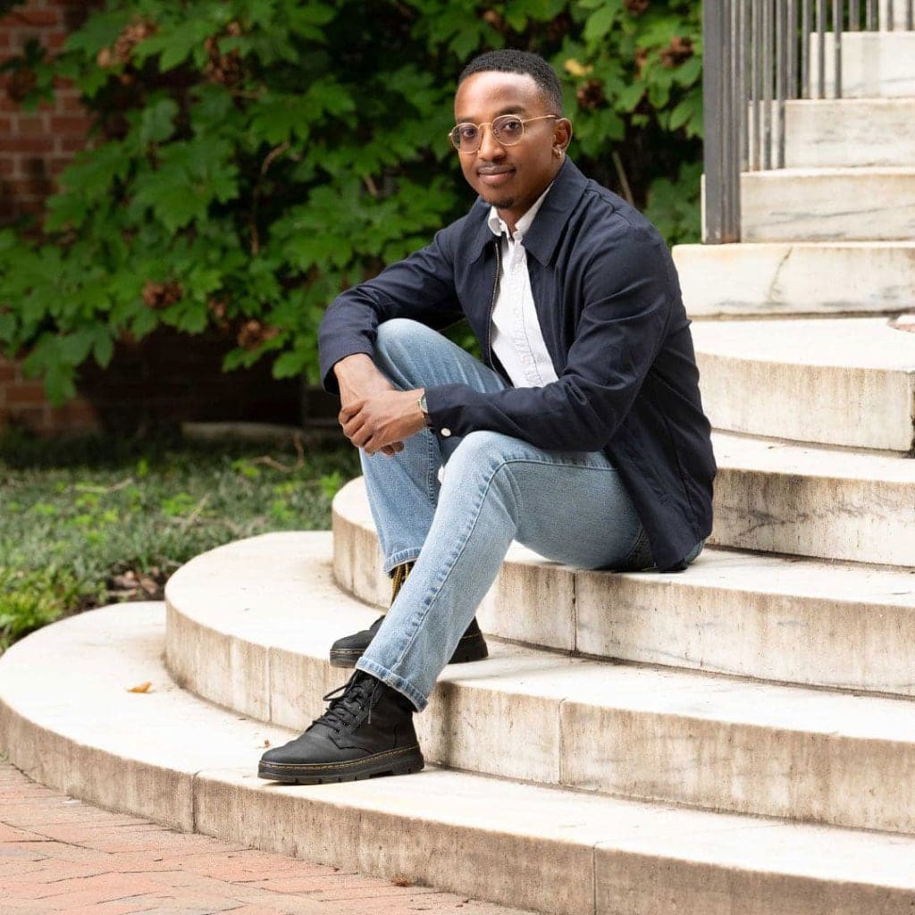 Kory Gaines sitting on marble steps