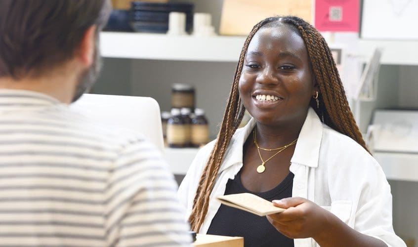 Student Olubusola Babalola working at her Community Impact Internship at Made in Baltimore.