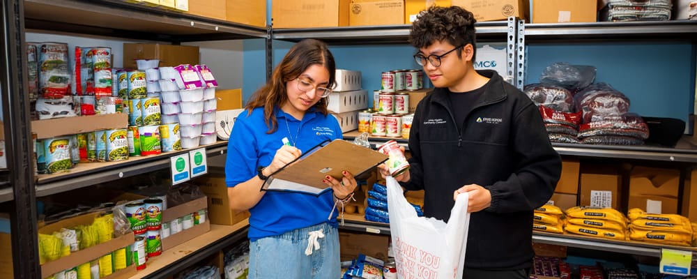 Two students in the food pantry at the Harriet Lane Clinic in East Baltimore.
