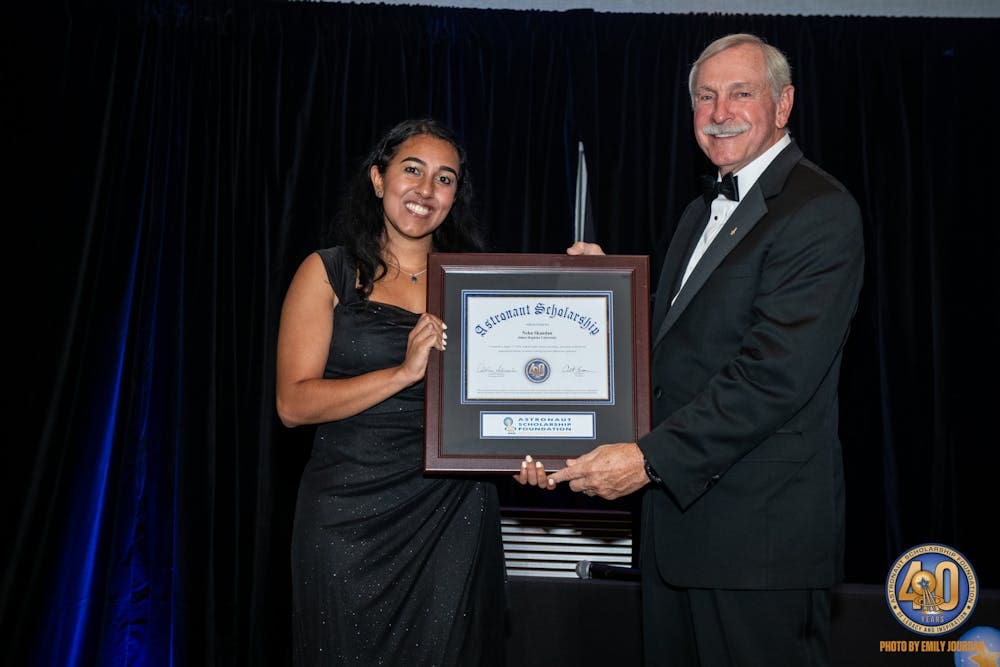 Image of Neha Skandan accepting the certificate of her Astronaut Scholarship at the 2024 Astronaut Scholarship Foundation’s Innovators Symposium & Gala.