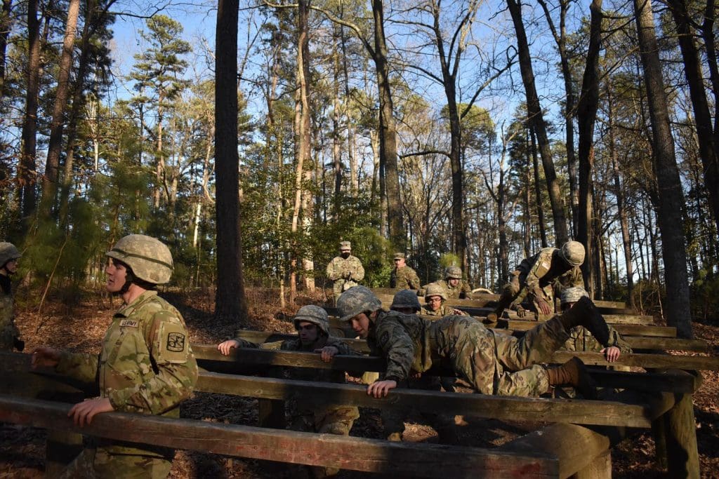 cadets navigating wooden fences