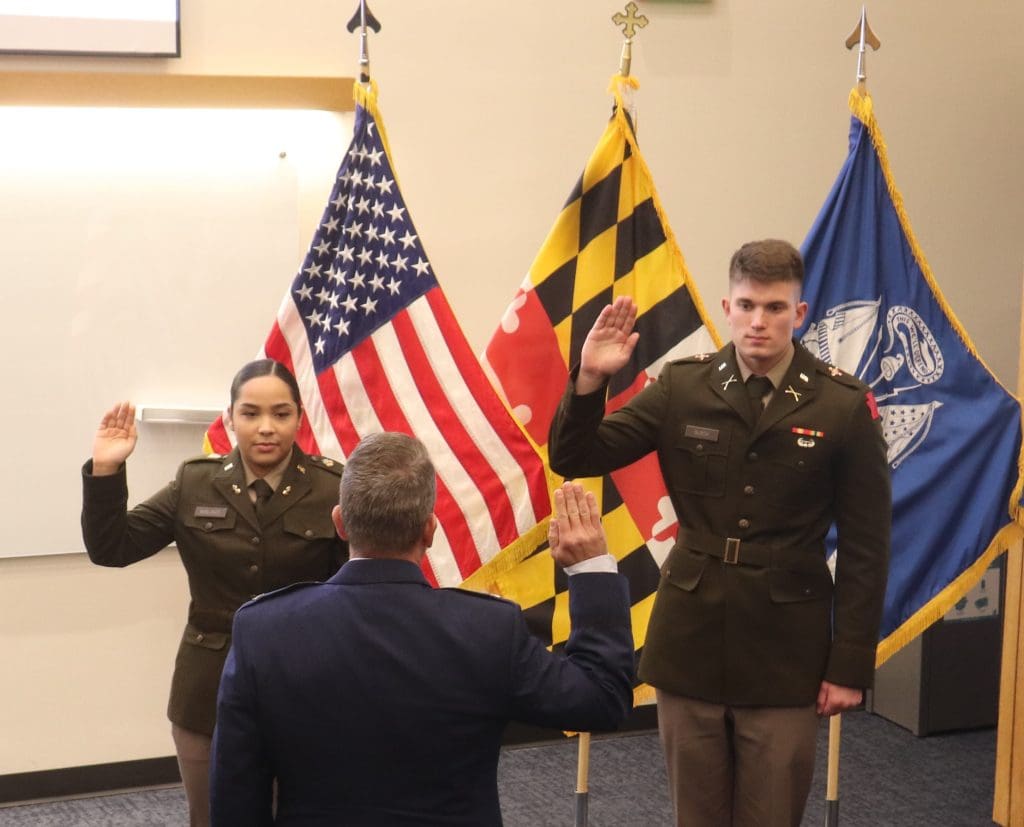 two cadets taking the oath of office