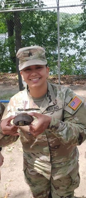 September CDT of the month Rebecca Cherian holding a turtle
