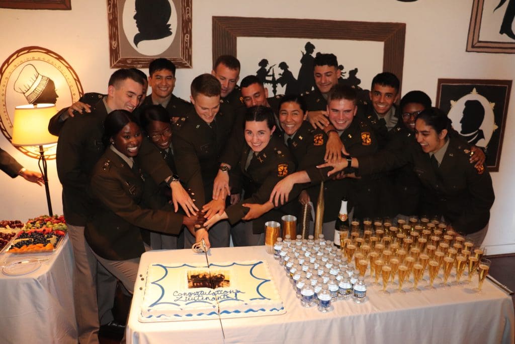 commissionees cutting cake 