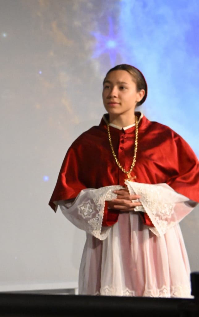 Paloma Hancock in red Cardinal costume