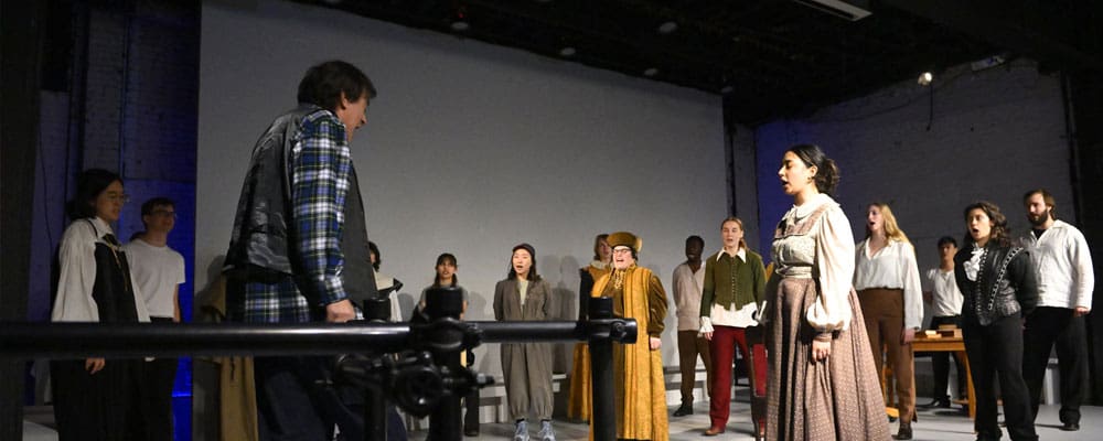 Director Jim Glossman working with the cast of Galileo