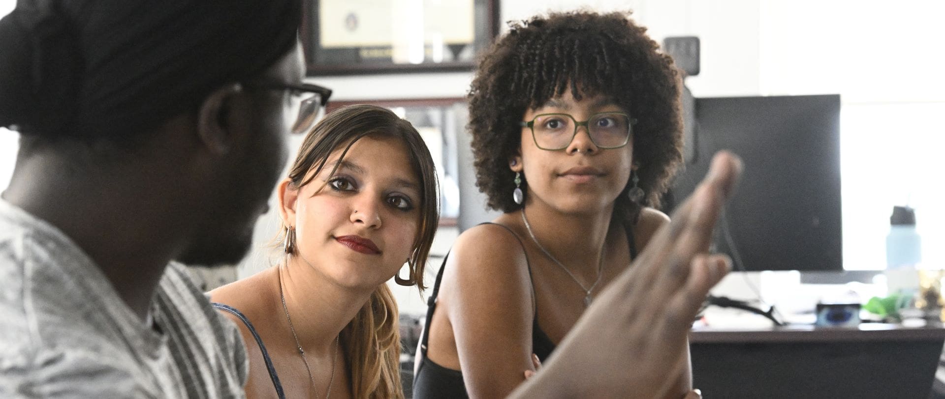 Three students in conversation