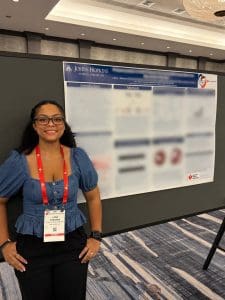 Lara Stevens with her research poster