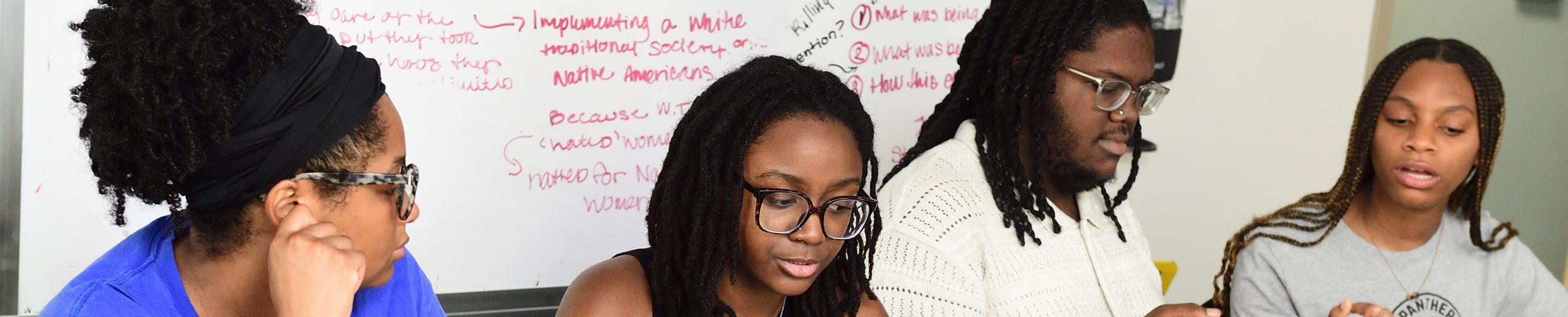 Four students collaborating