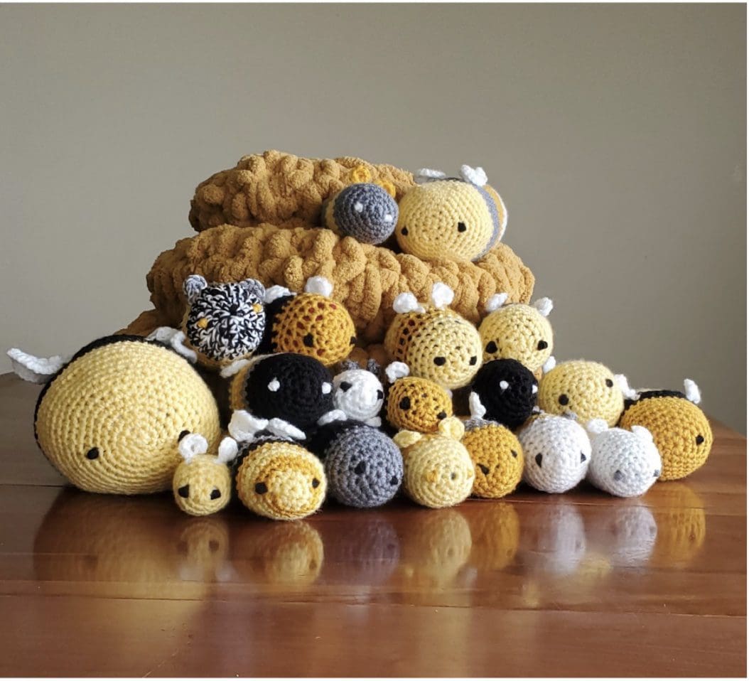pile of knitted round creatures with eyes