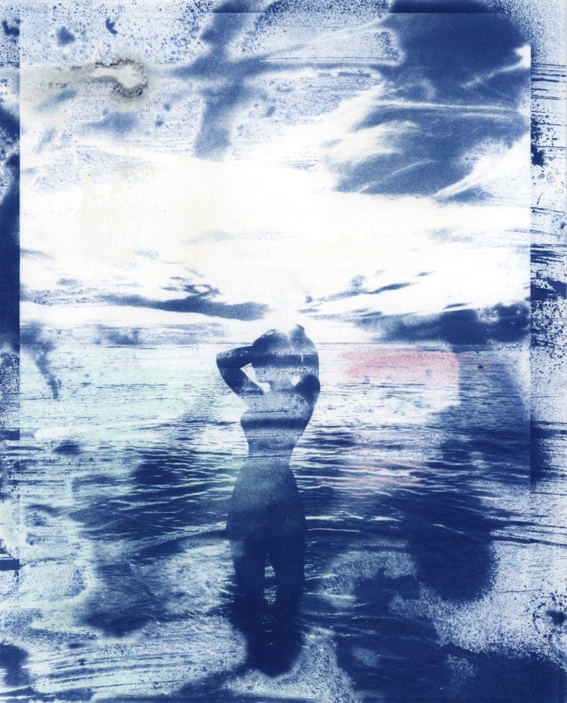 cyanotype of an ocean wave and skyline overlayed on top of a silhouetted person