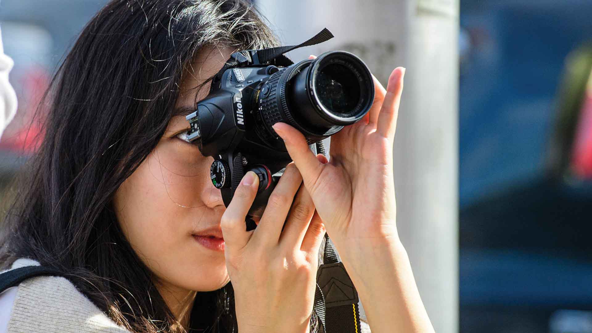 girl using a camera to take a picture