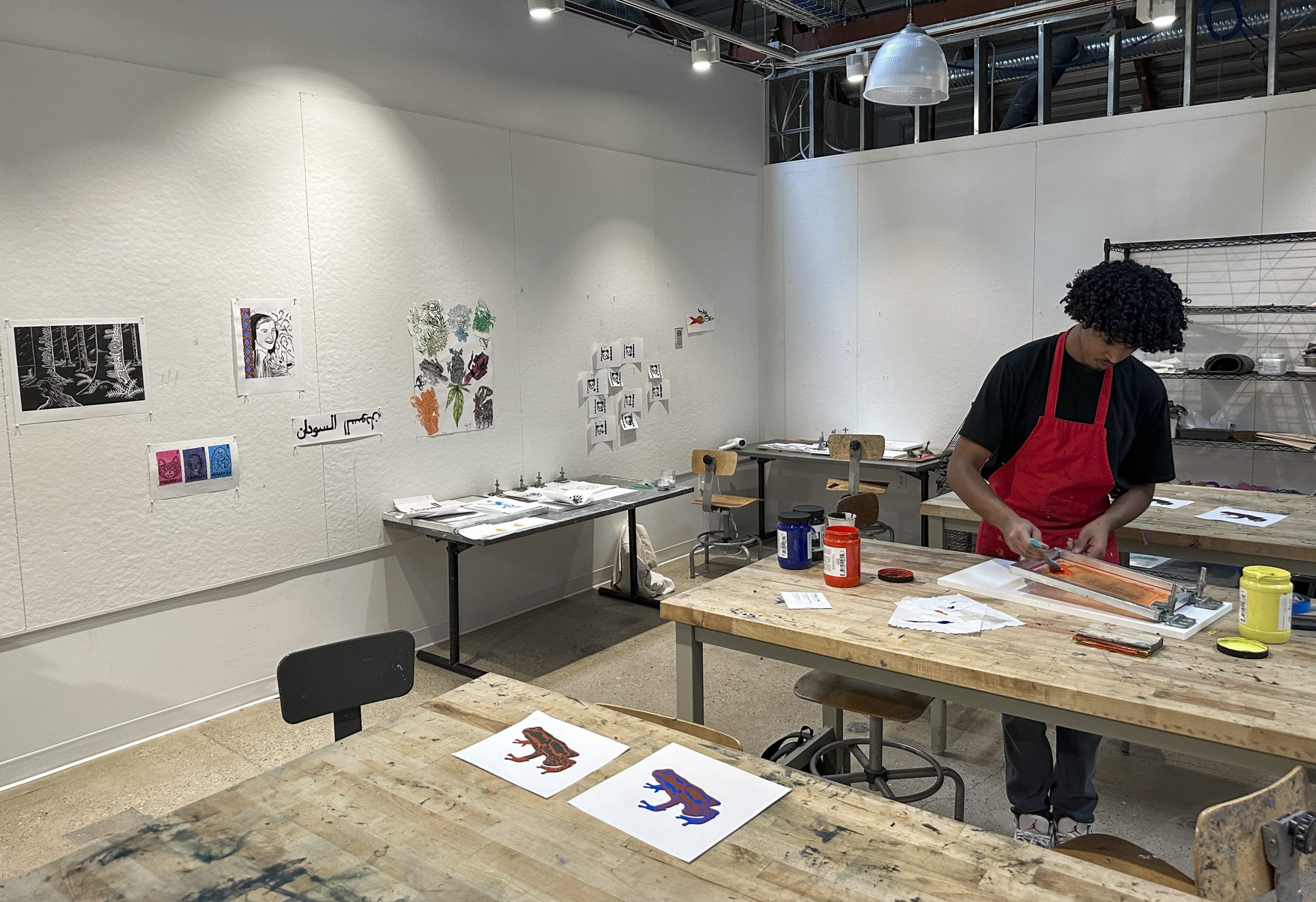 student screen printing in art classroom