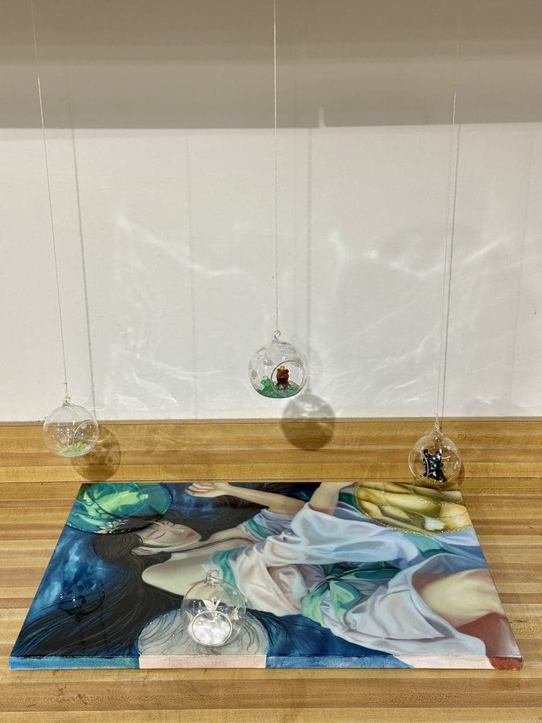 a 3D installation of hanging options of a painting