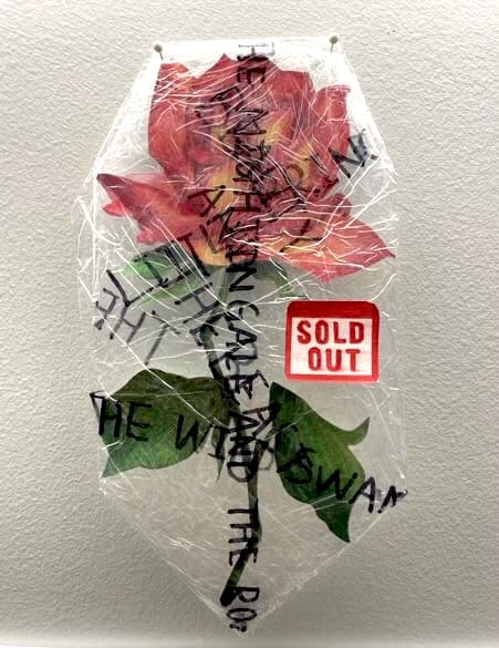 drawing of a flower wrapped in plastic with text that reads "sold out"