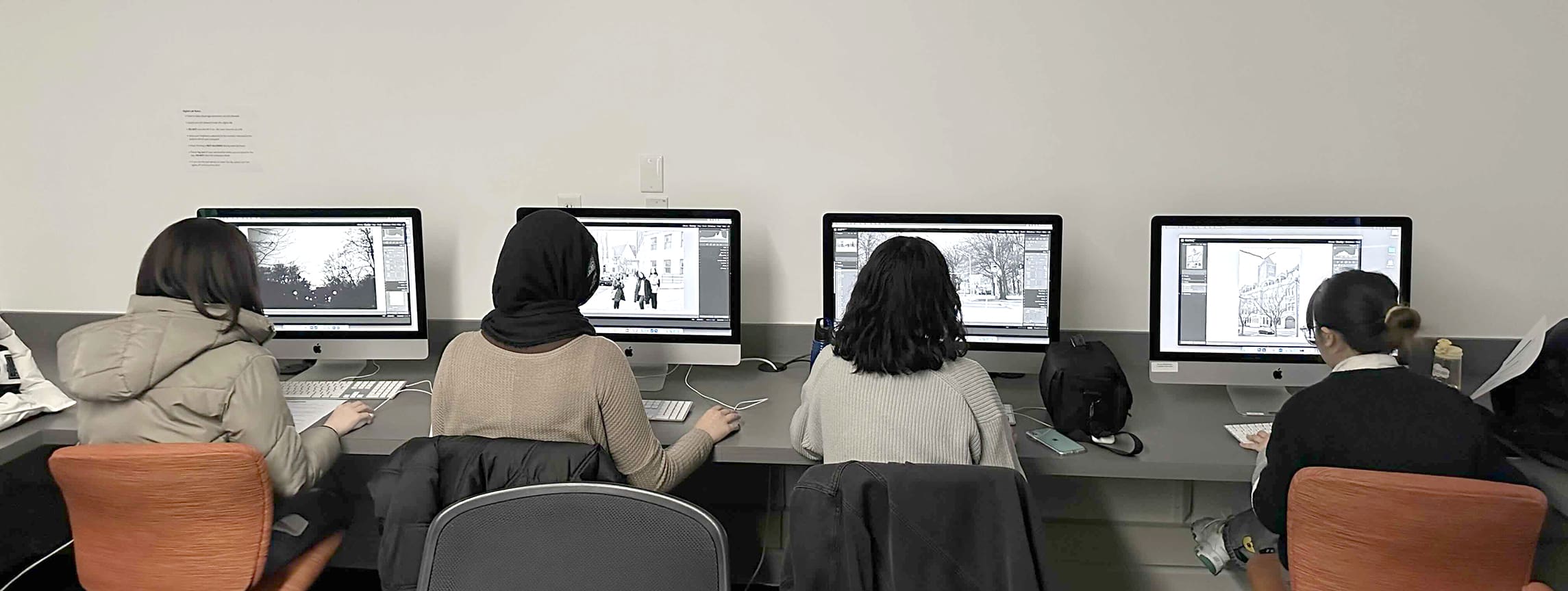 students working on mac computers