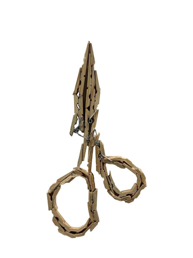 a pair of scissors made from clothes pins