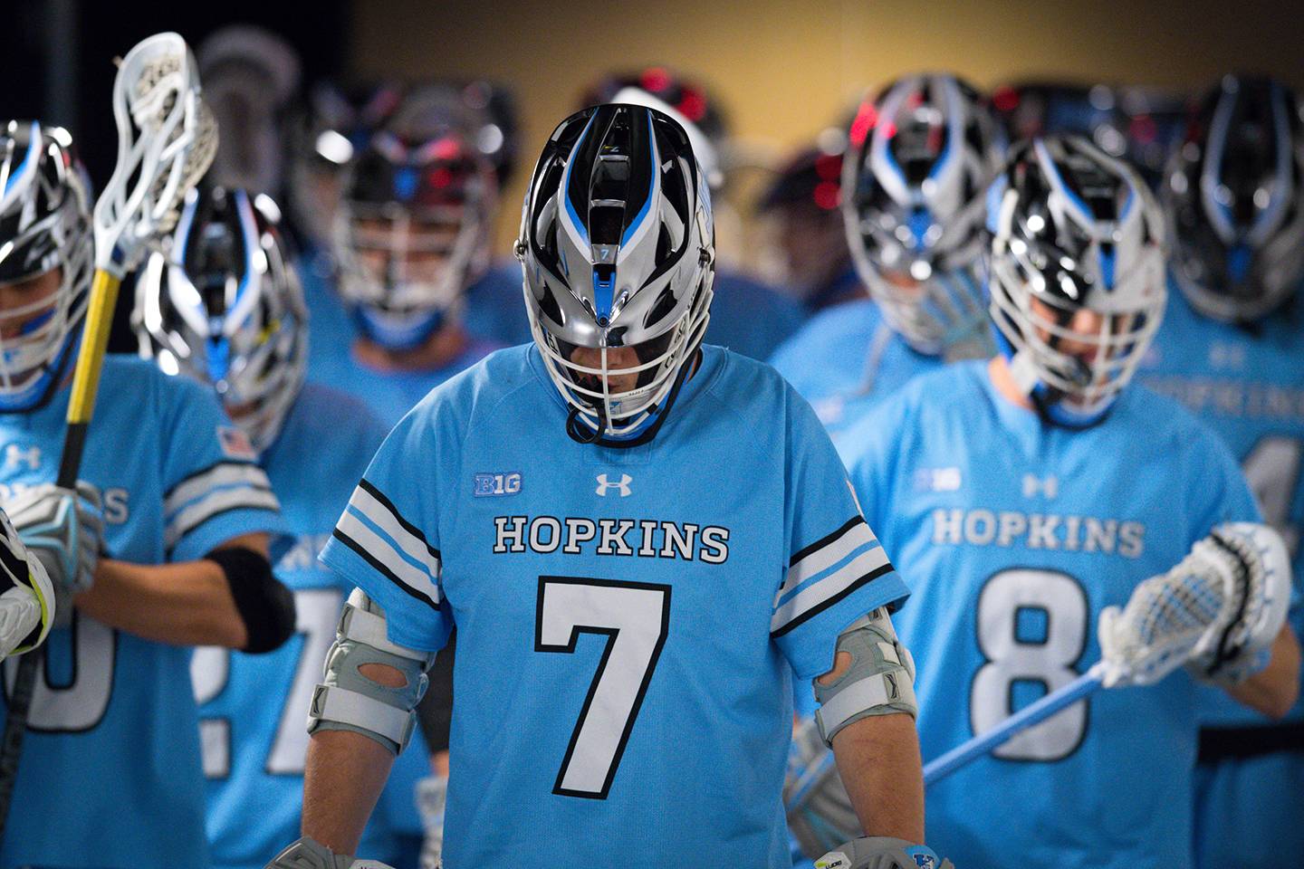 a group of Hopkins lacrosse players in their uniforms