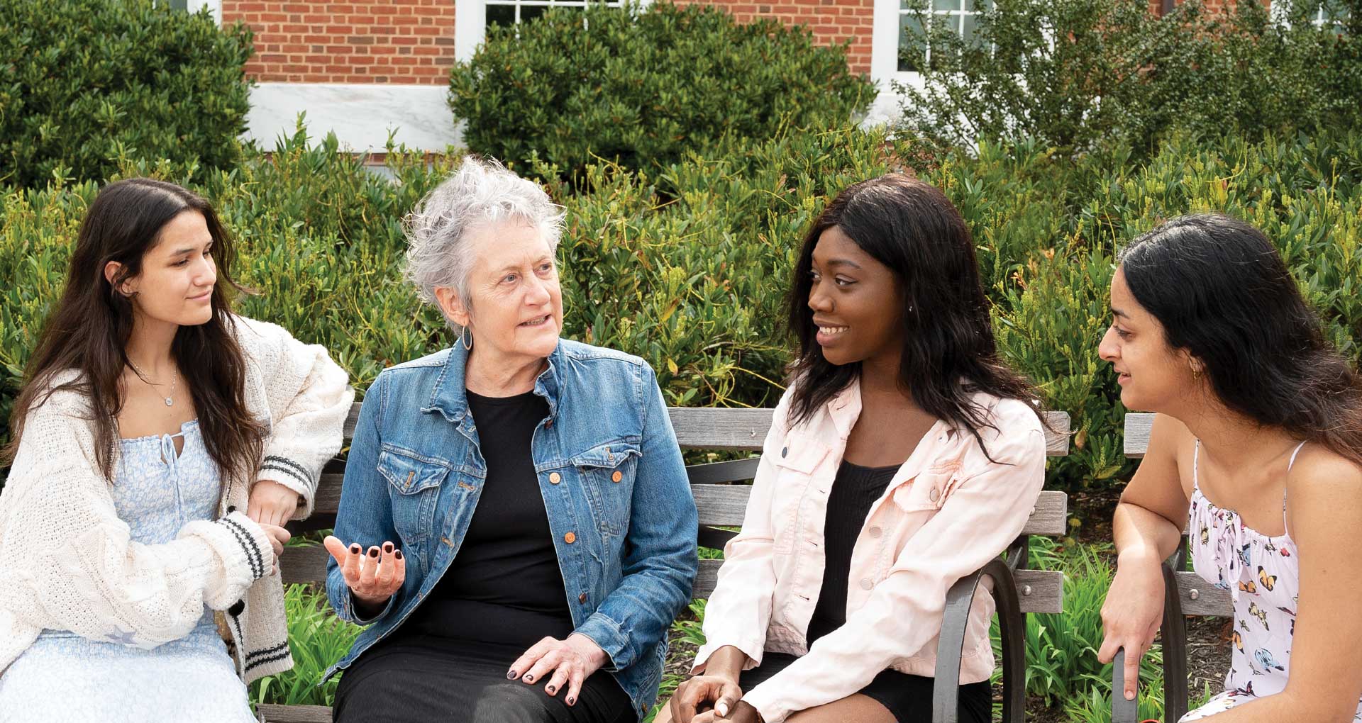 Economics Professor Barbara Morgan with three female students