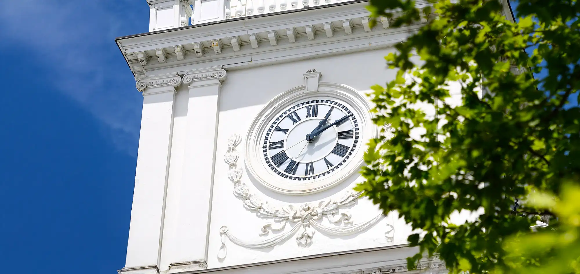 close-up of Gilman clock tower clock face on clear sunny day