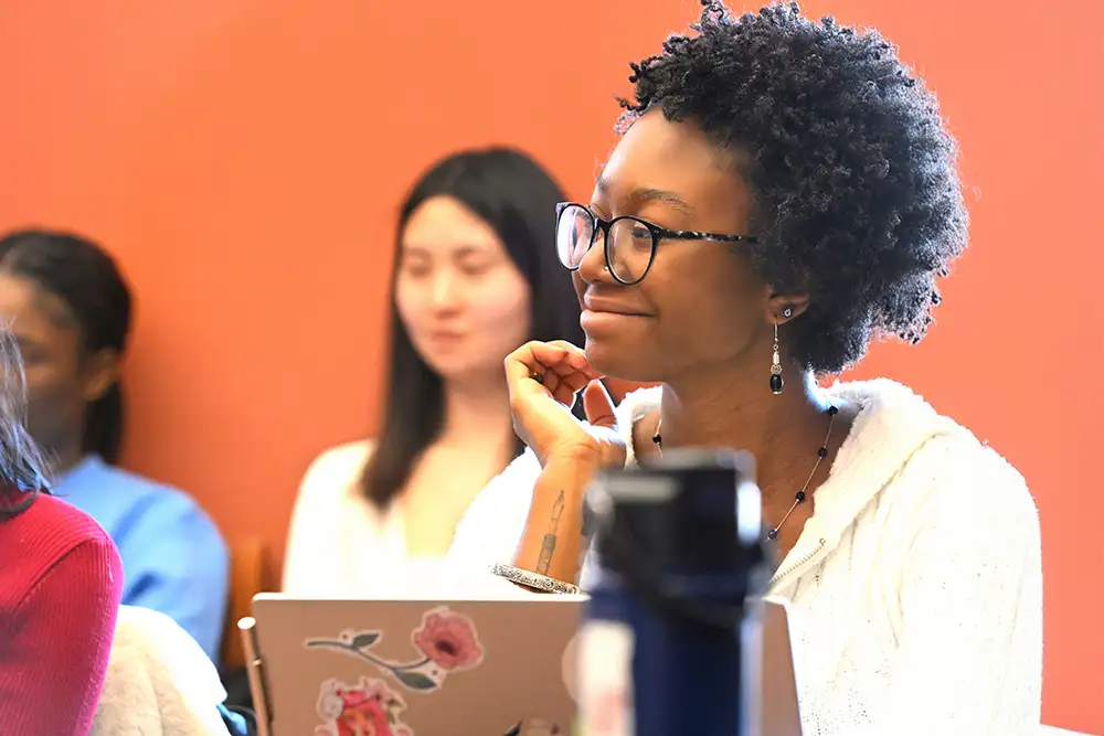 student in class smiling